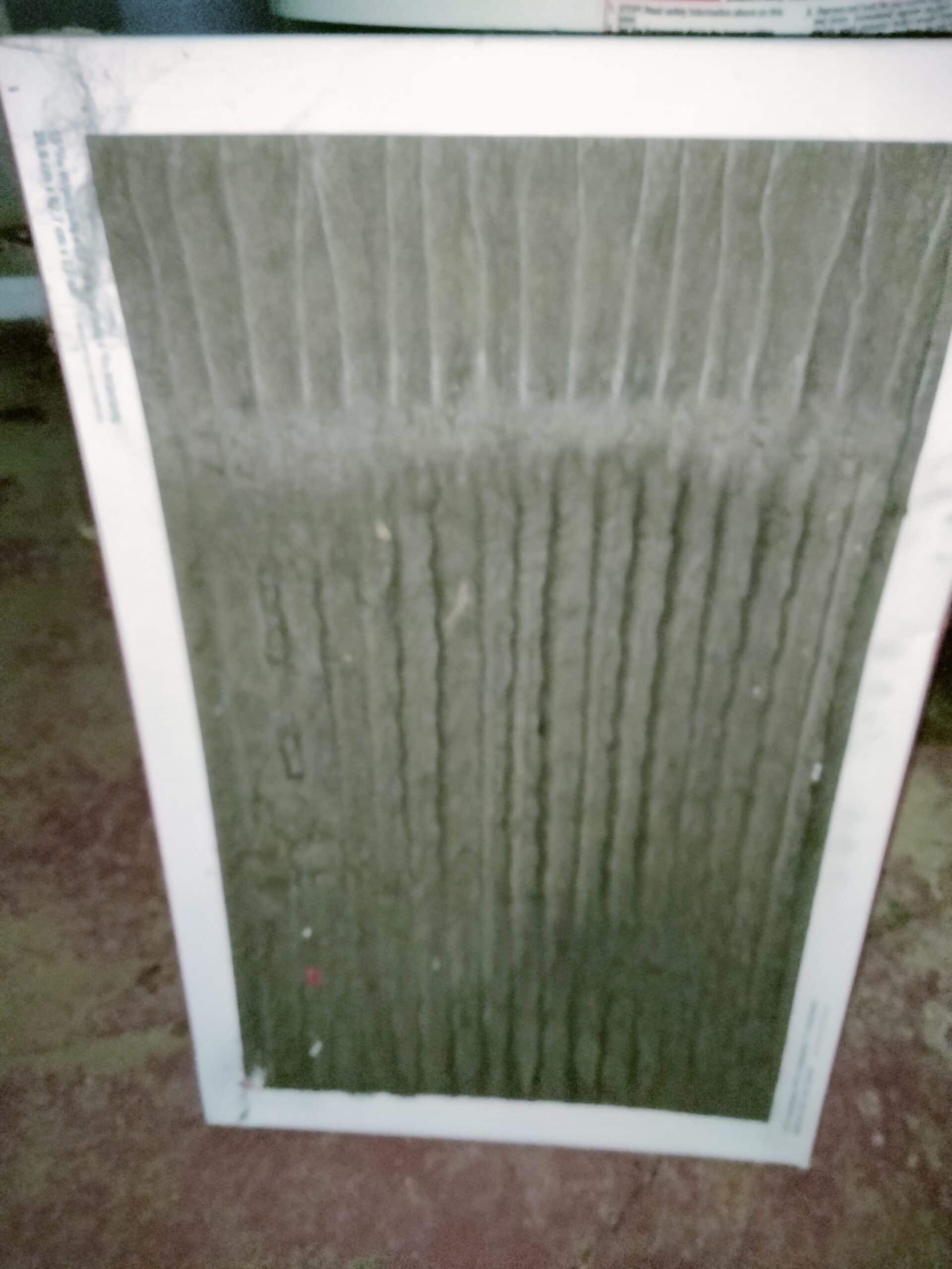 Dirty HVAC filter ready for replacement